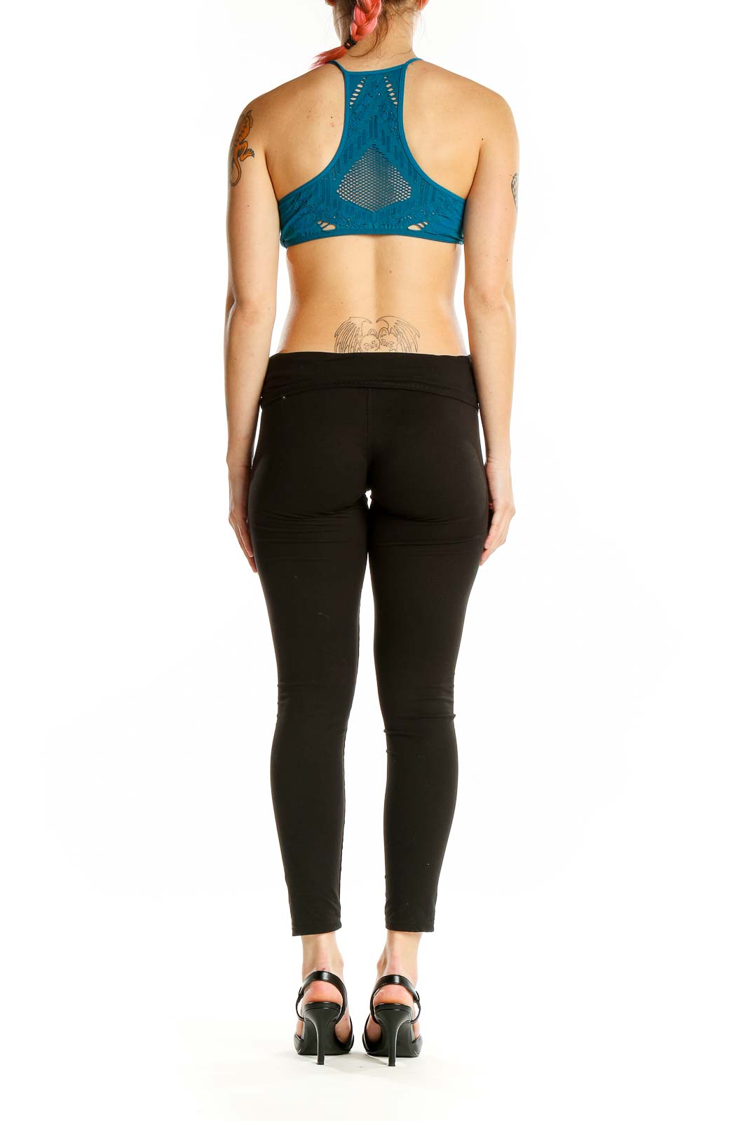 Back view of teal cutout halter crop top by Intimately Free People showing intricate design