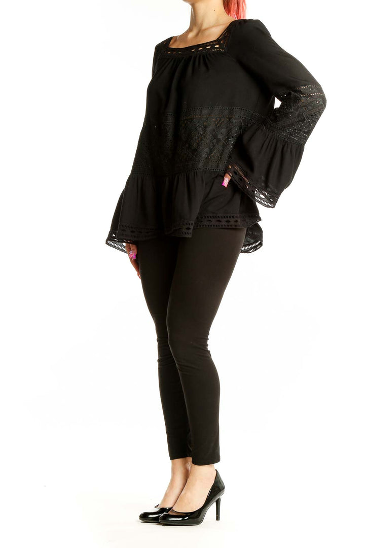 Front view of Max Studio black lace-trimmed blouse with bell sleeves