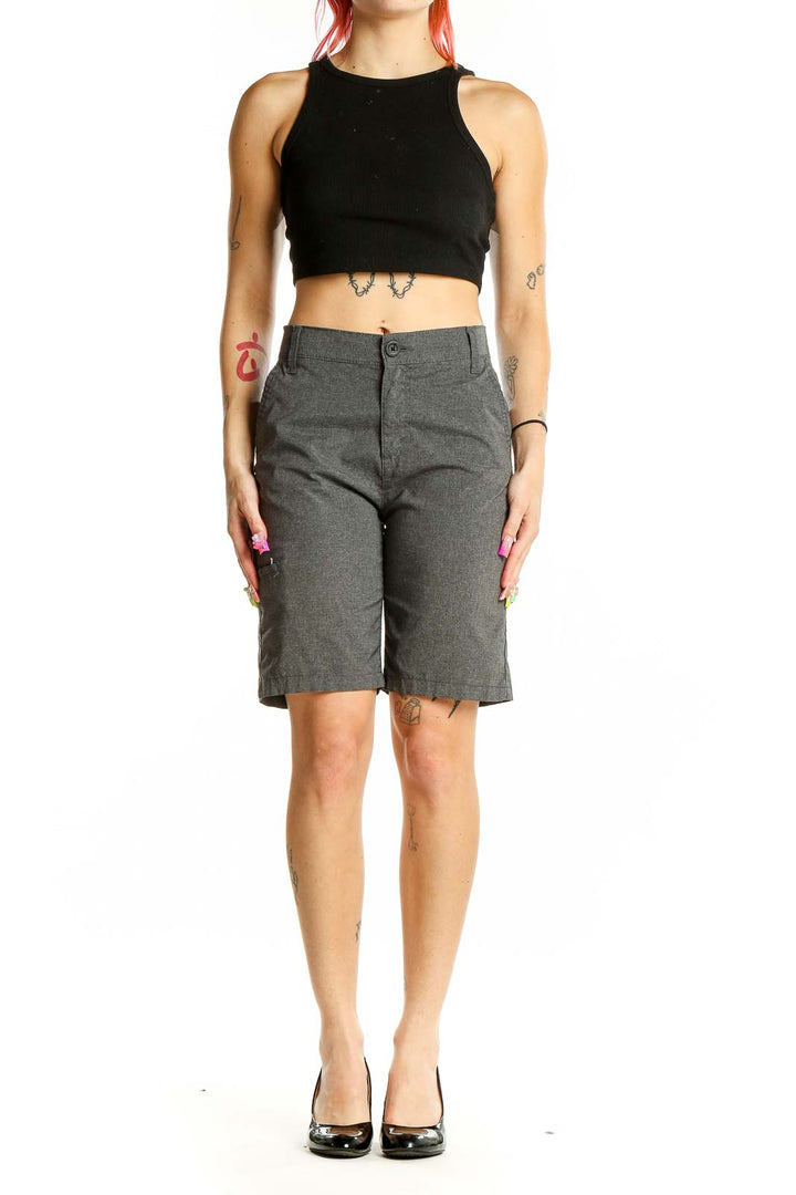 Front view of gray Levi's Bermuda shorts on model