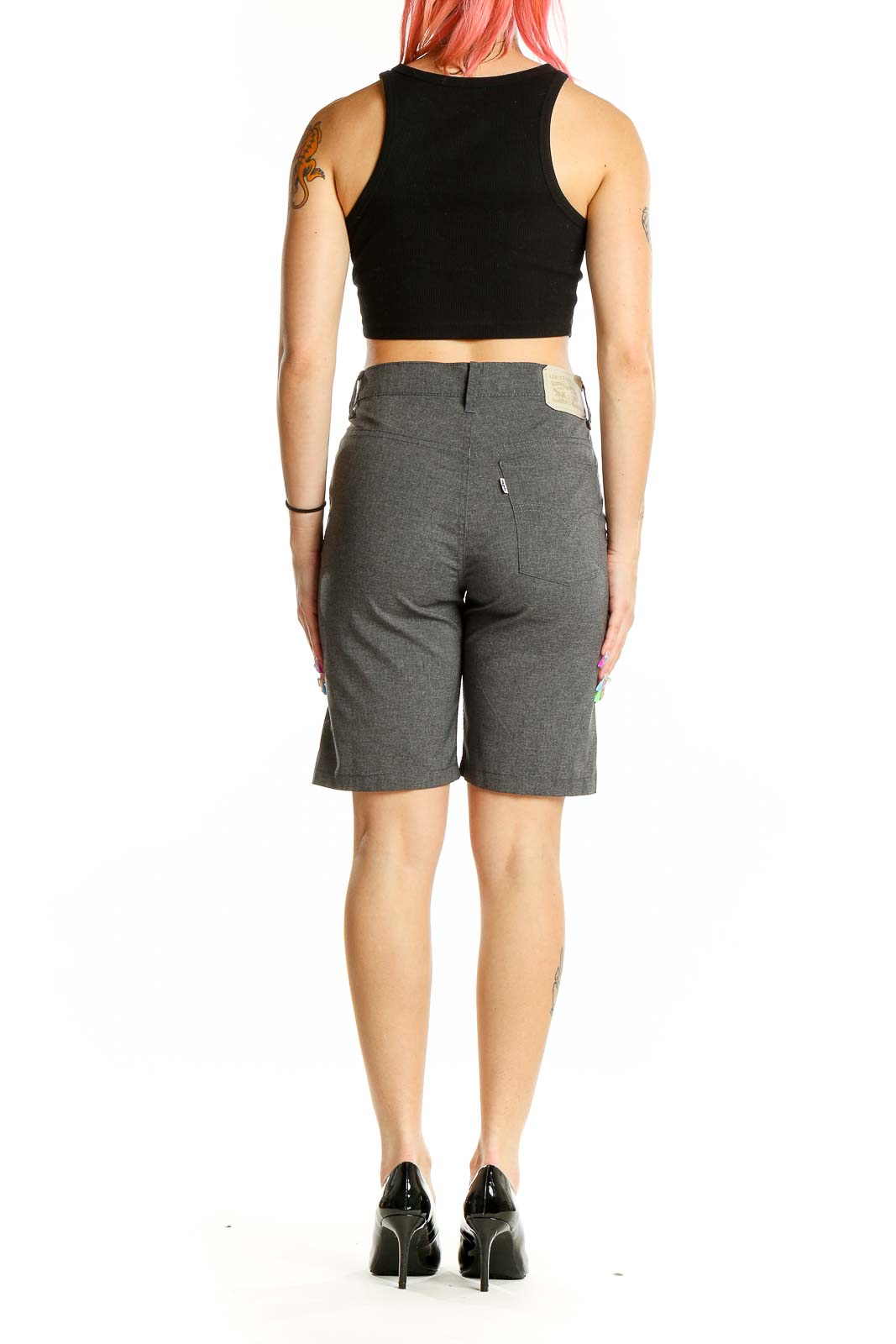 Back view of gray Levi's Bermuda shorts on model with black crop top