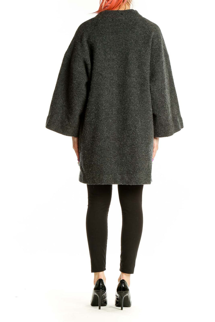 Back view of MICHAEL Michael Kors charcoal oversized wool coat showing bell sleeves