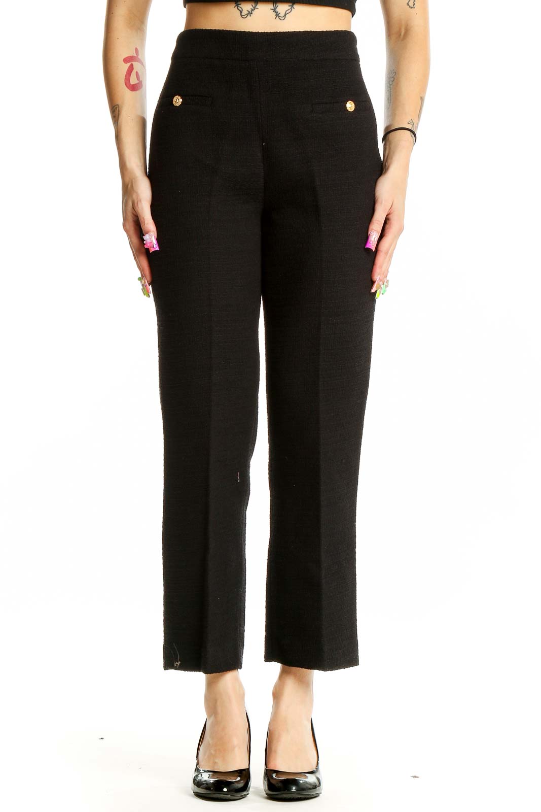 Front view of Zara black high-waisted tailored trousers with gold button accents