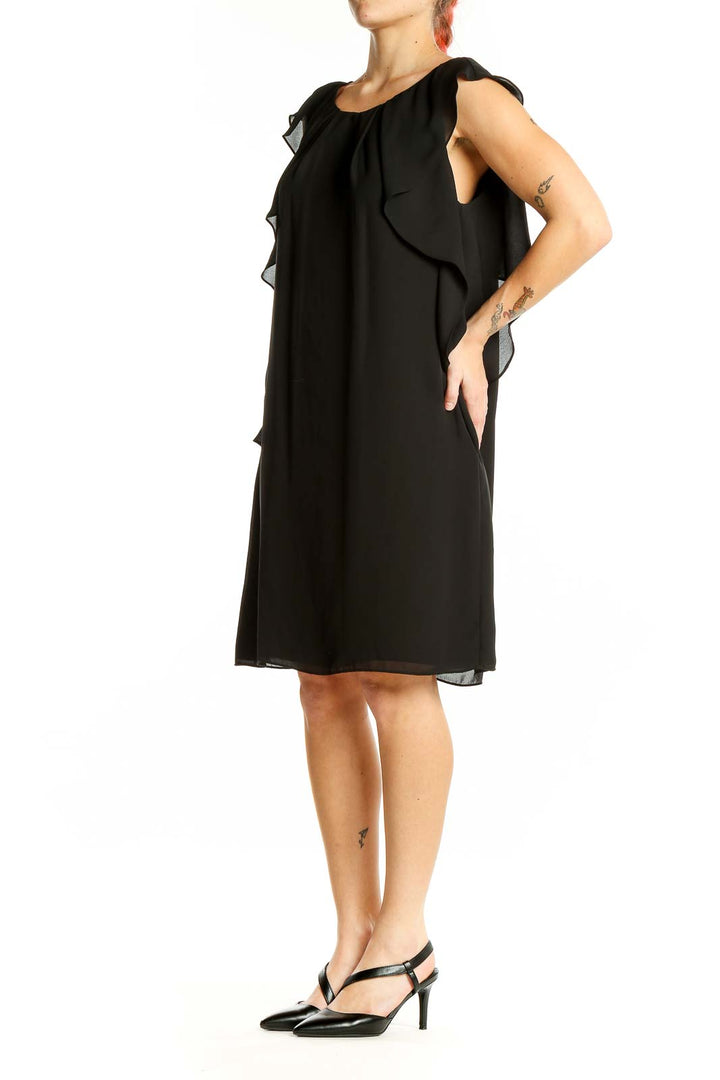 Front view of black Vince Camuto cocktail dress with ruffled cap sleeves