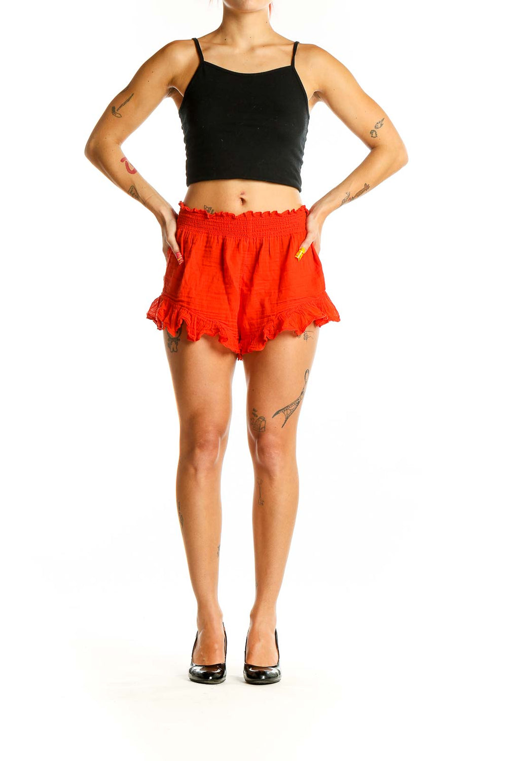 Front view of red ruffled cotton shorts with smocked waistband