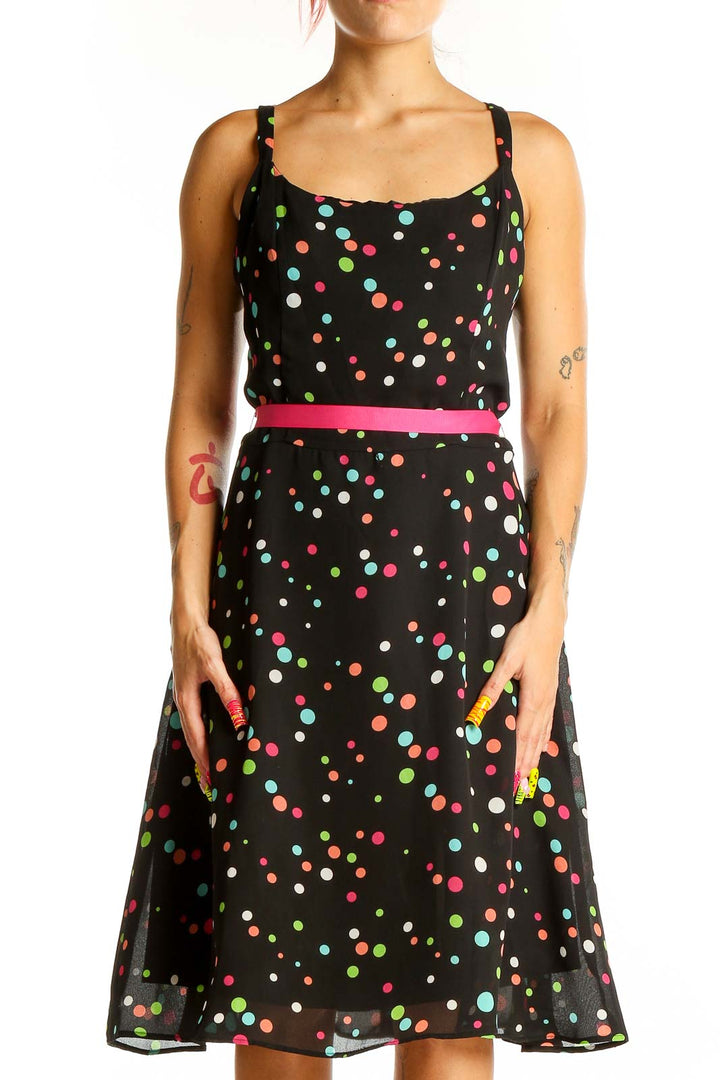 Front view of K & Company black polka dot sleeveless dress with hot pink belt