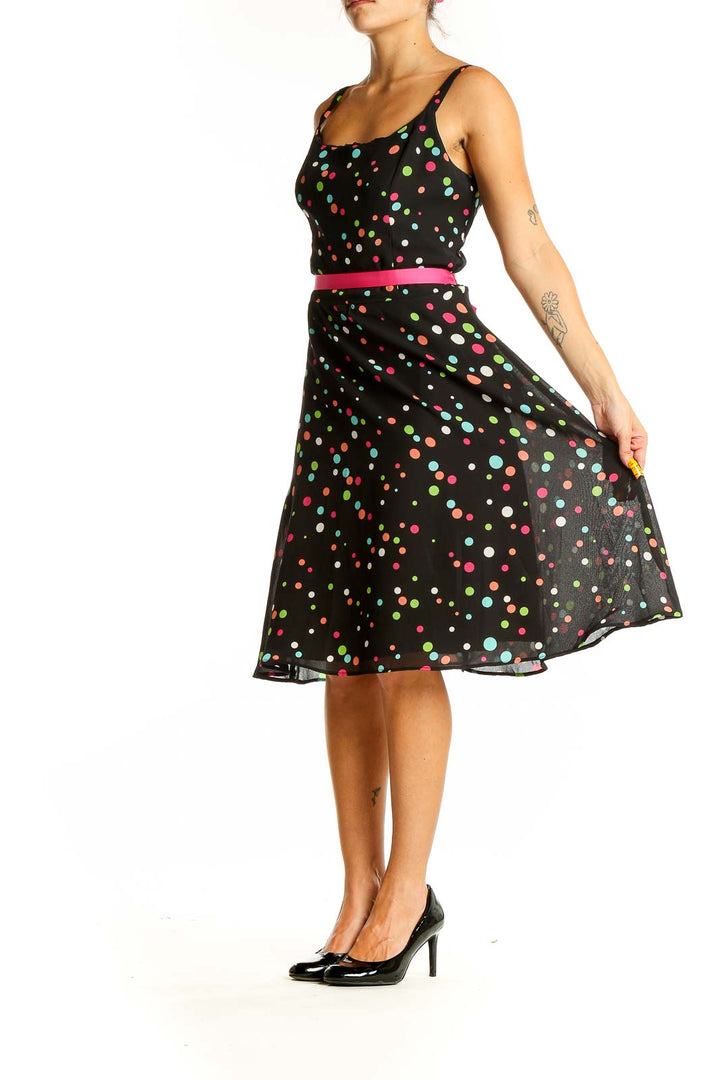 Front view of K & Company black polka dot sleeveless dress with hot pink belt