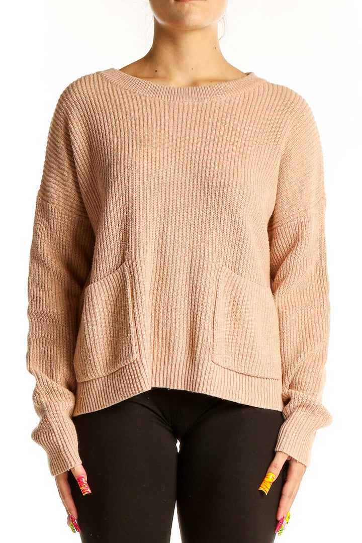 Front view of Madewell beige ribbed knit sweater with pockets