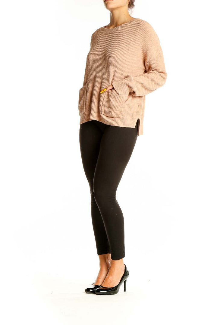 Front view of Madewell beige ribbed knit sweater with pockets