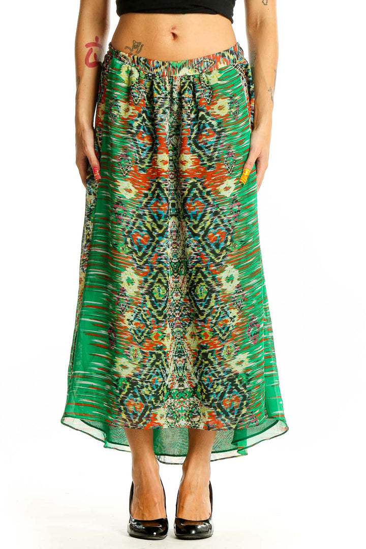 Front view of green patterned INC maxi skirt with abstract design