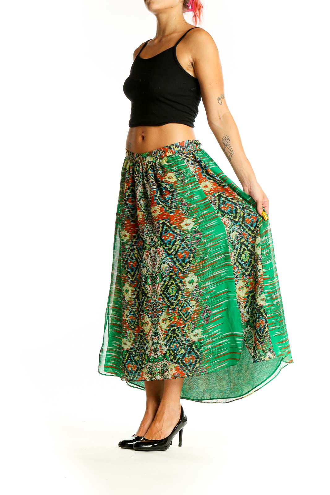 Front view of green patterned INC maxi skirt with abstract design