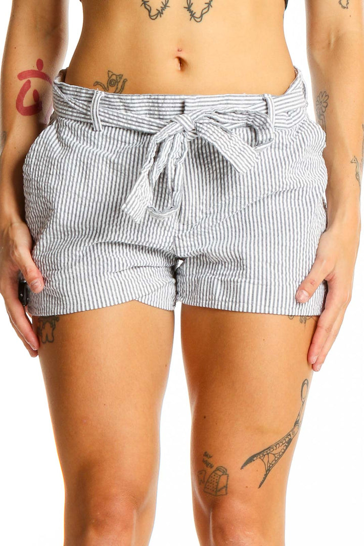 Front view of Banana Republic gray striped high-waisted shorts with self-tie belt