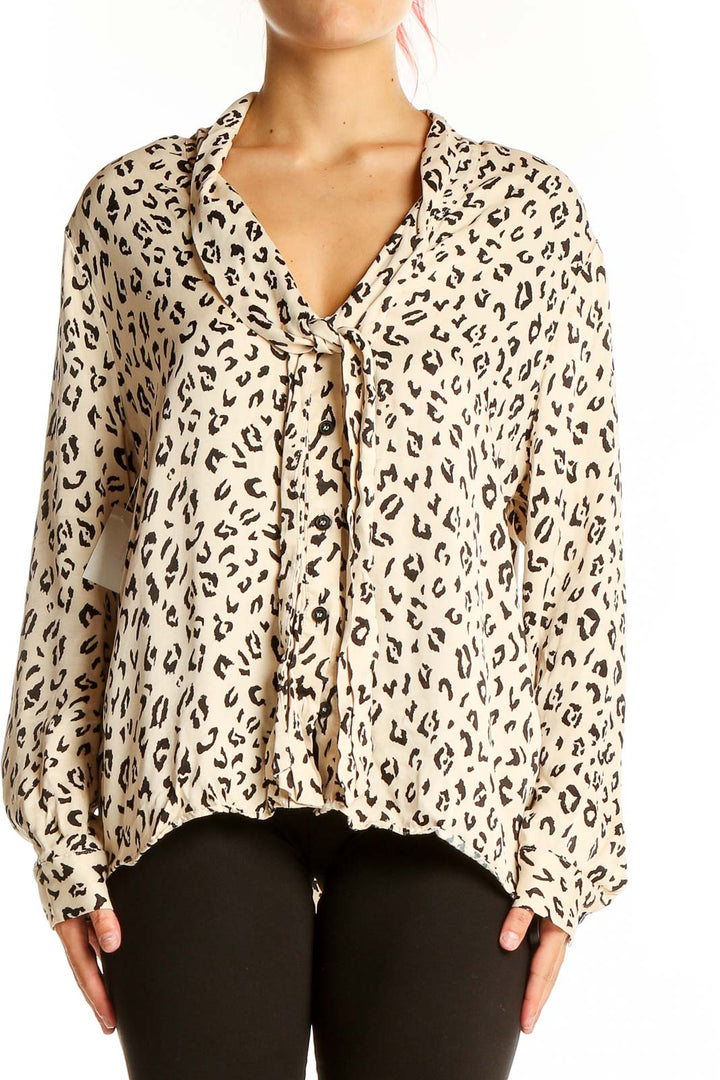 Front view of Zara beige leopard print tie-front blouse