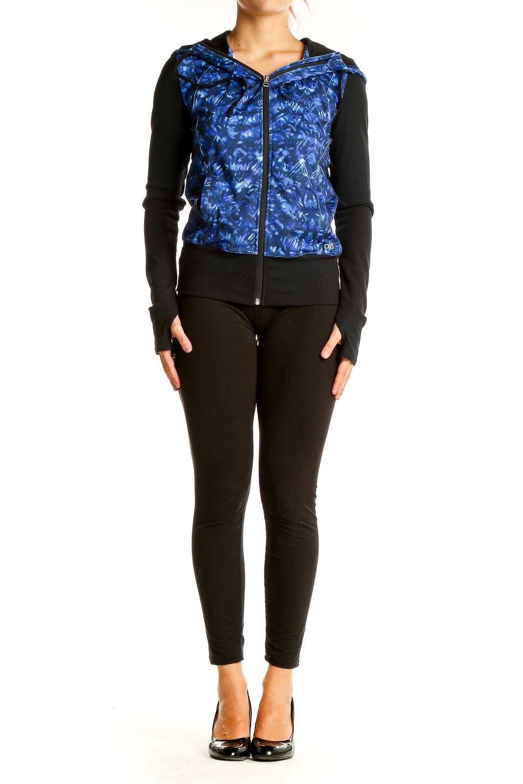 Front view of Alo Yoga blue patterned activewear jacket with black sleeves