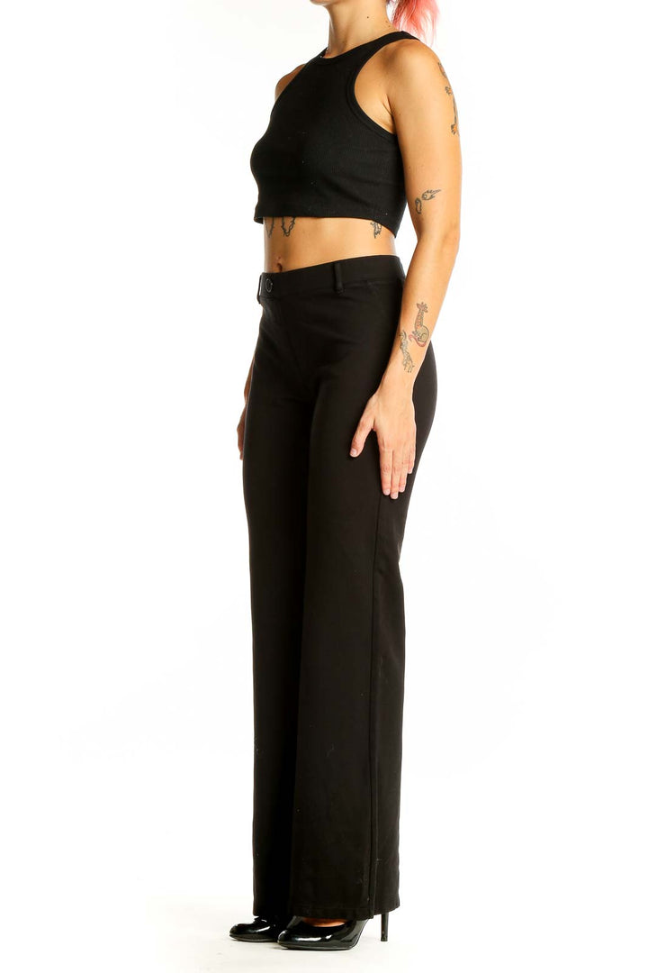 Front view of Betabrand black wide-leg dress pants on model