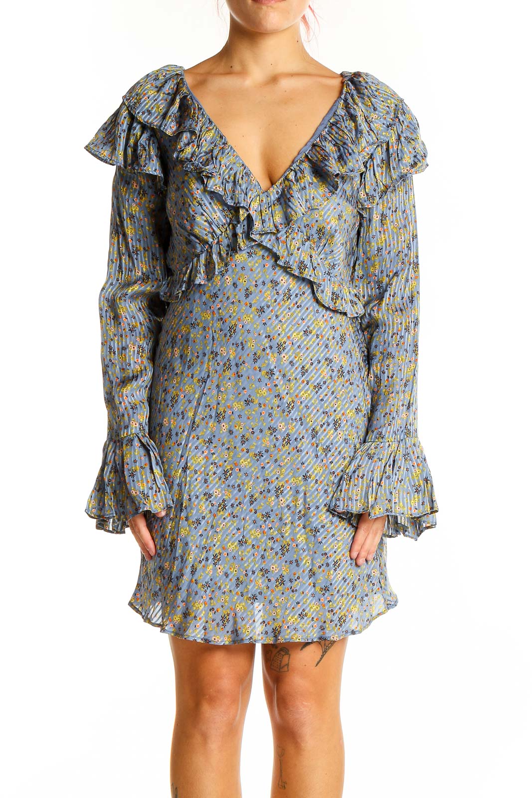 Front view of Free People blue floral ruffled mini dress with V-neckline