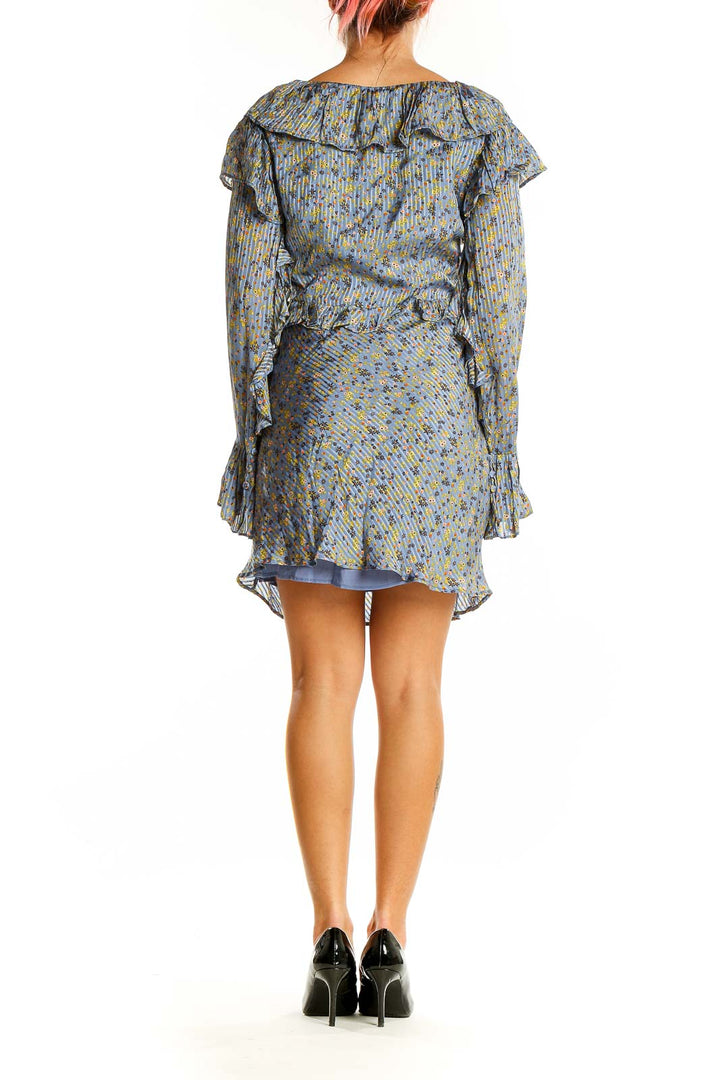 Back view of Free People blue floral mini dress showing ruffled details