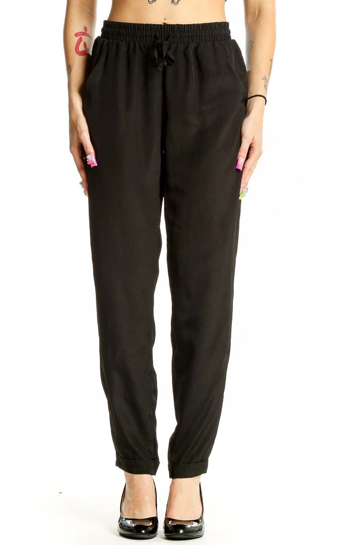 Front view of Olive & Oak black polyester pants with drawstring waist