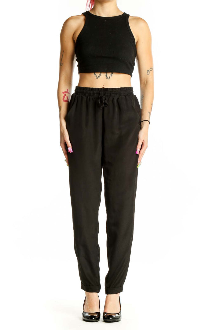 Front view of Olive & Oak black polyester pants with drawstring waist