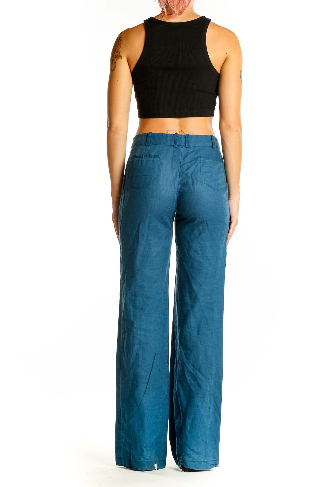 Back view of BCBG MaxAzria teal wide-leg pants showing relaxed fit