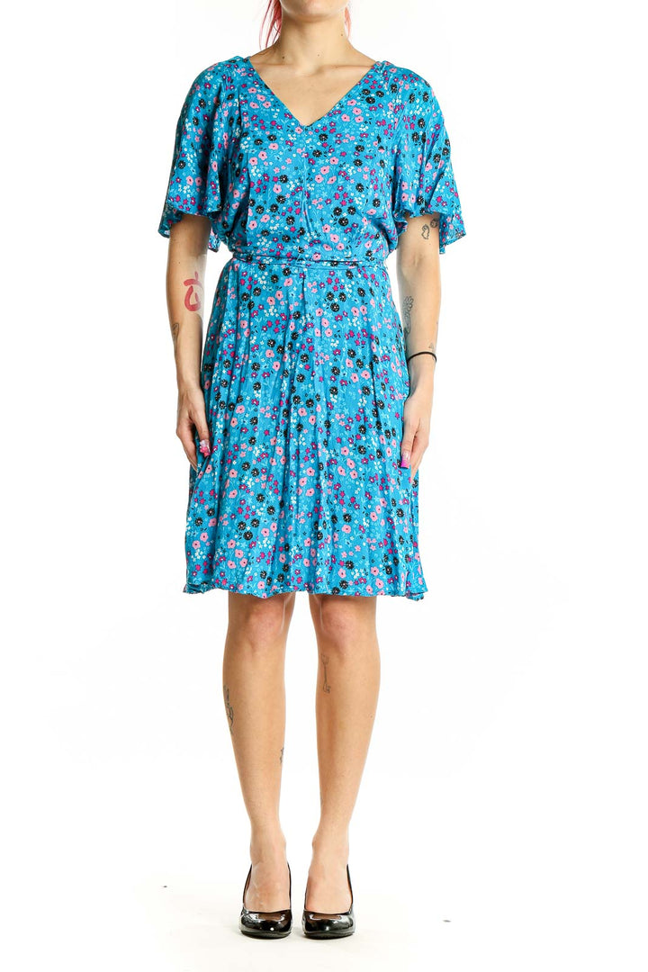 Front view of Calvin Klein blue floral flutter sleeve dress with V-neck