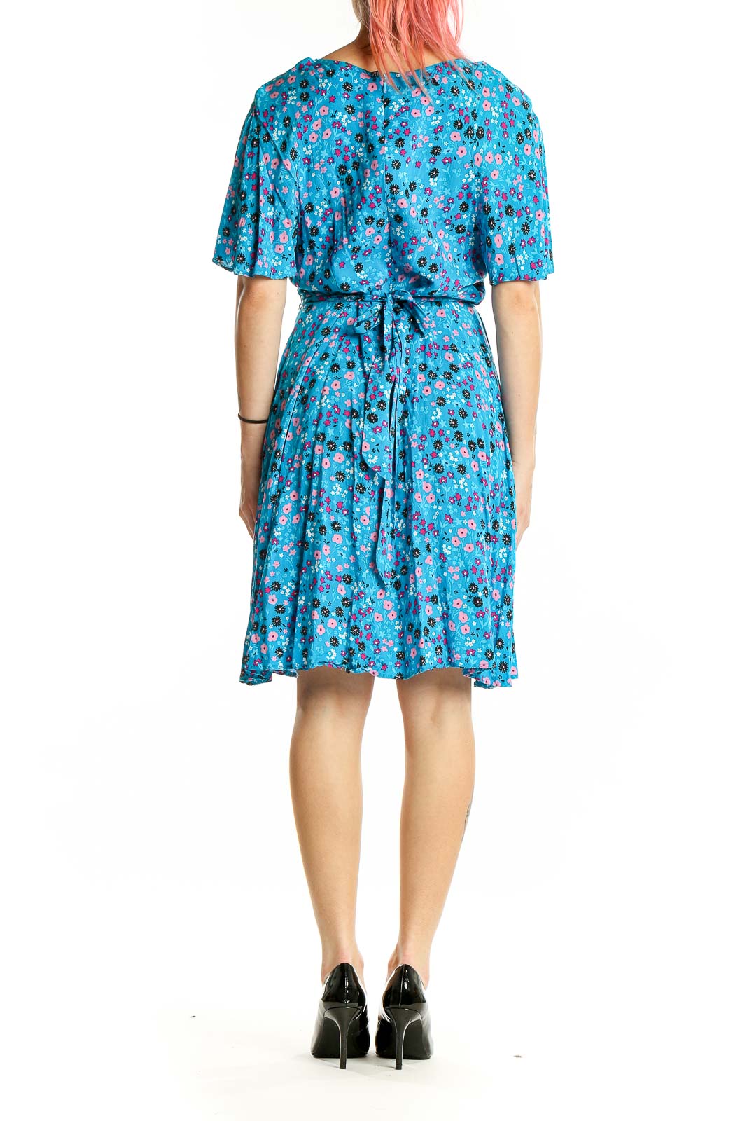 Back view of Calvin Klein blue floral flutter sleeve dress with tie waist