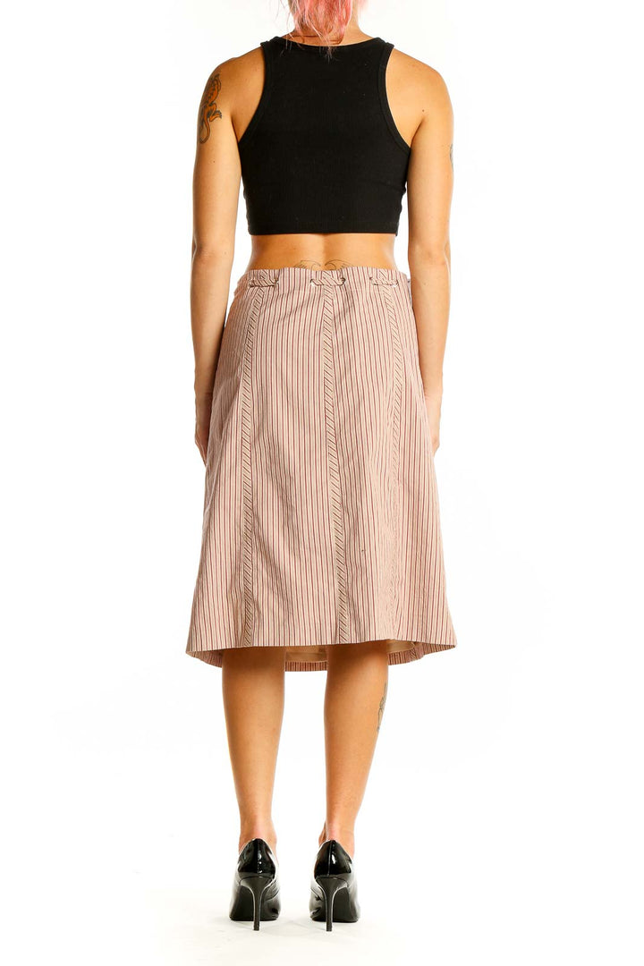 Back view of BCBG MaxAzria beige striped A-line midi skirt showing vertical stripe pattern