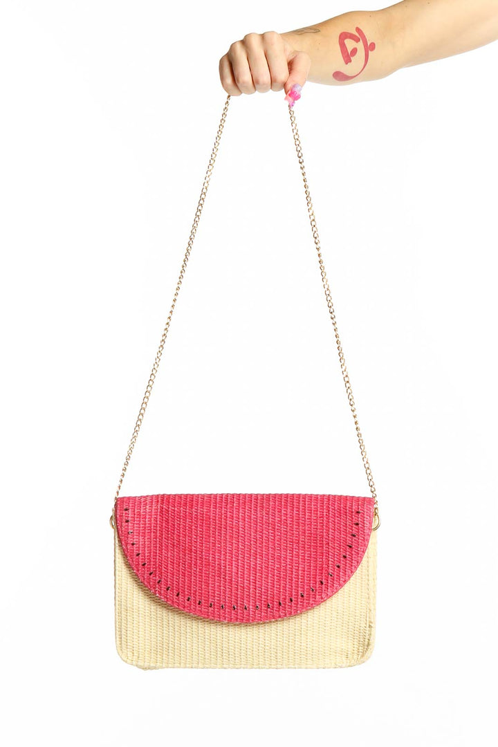 Front view of Escada Sorbetto Rosso pink and beige woven straw crossbody bag