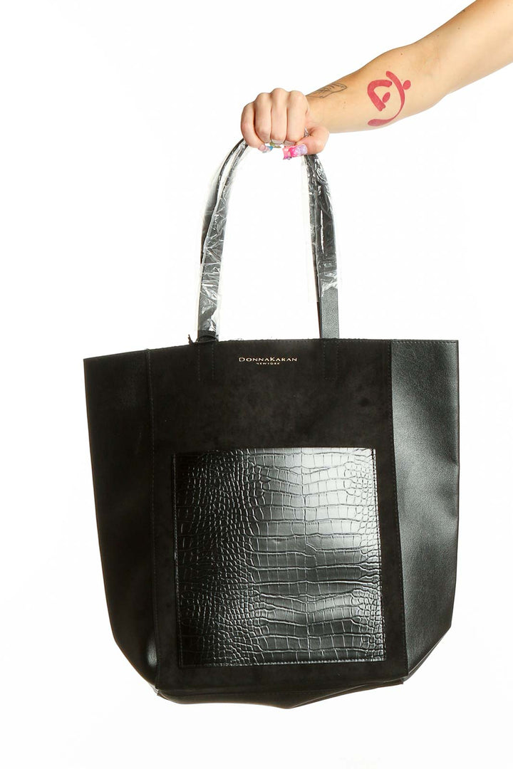 Front view of Donna Karan New York black tote bag with croc-embossed panel