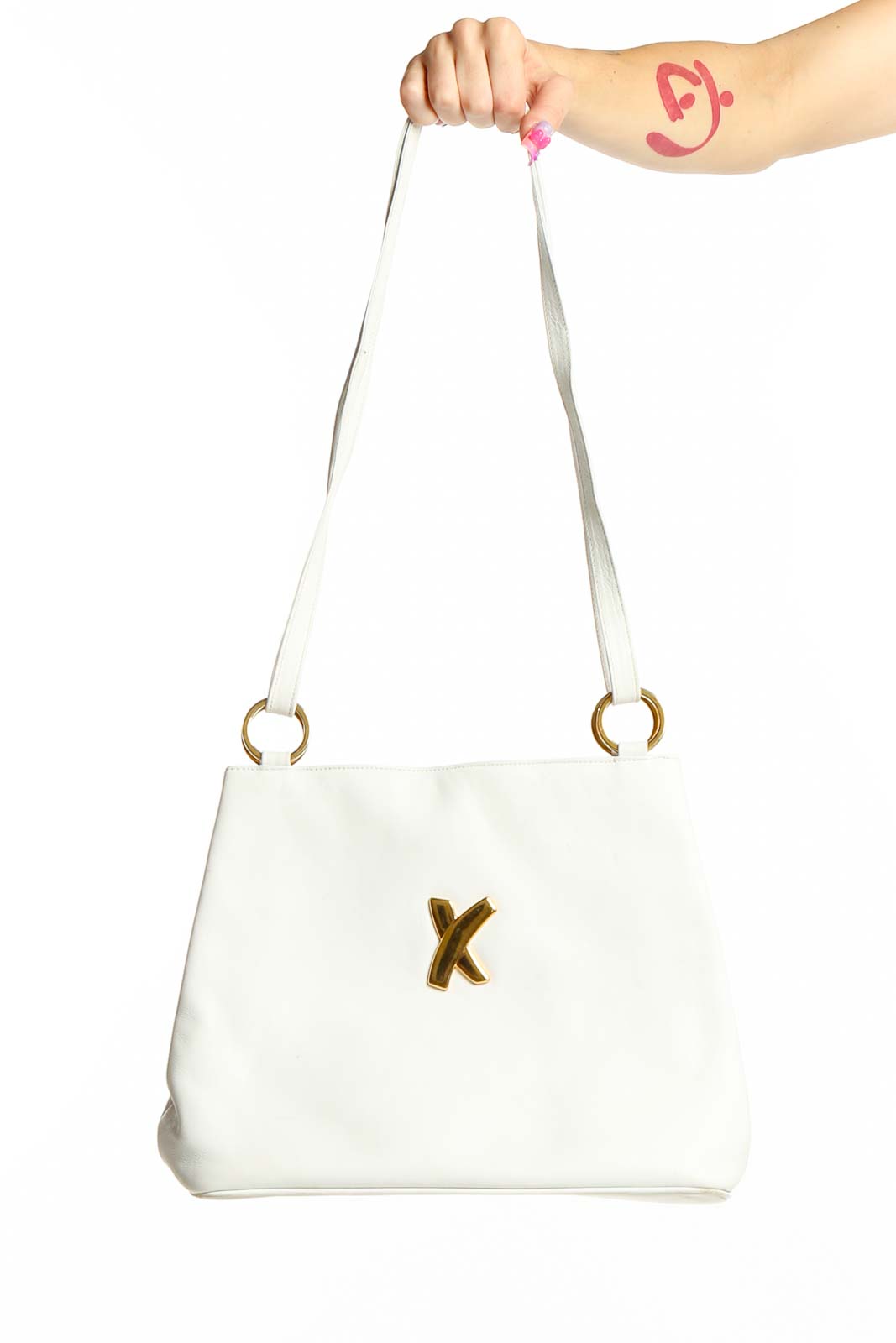 Front view of white leather Paloma Picasso crossbody bag with gold 'X' accent