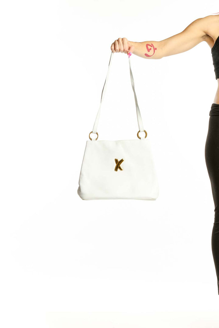 Front view of white leather Paloma Picasso crossbody bag with gold 'X' accent