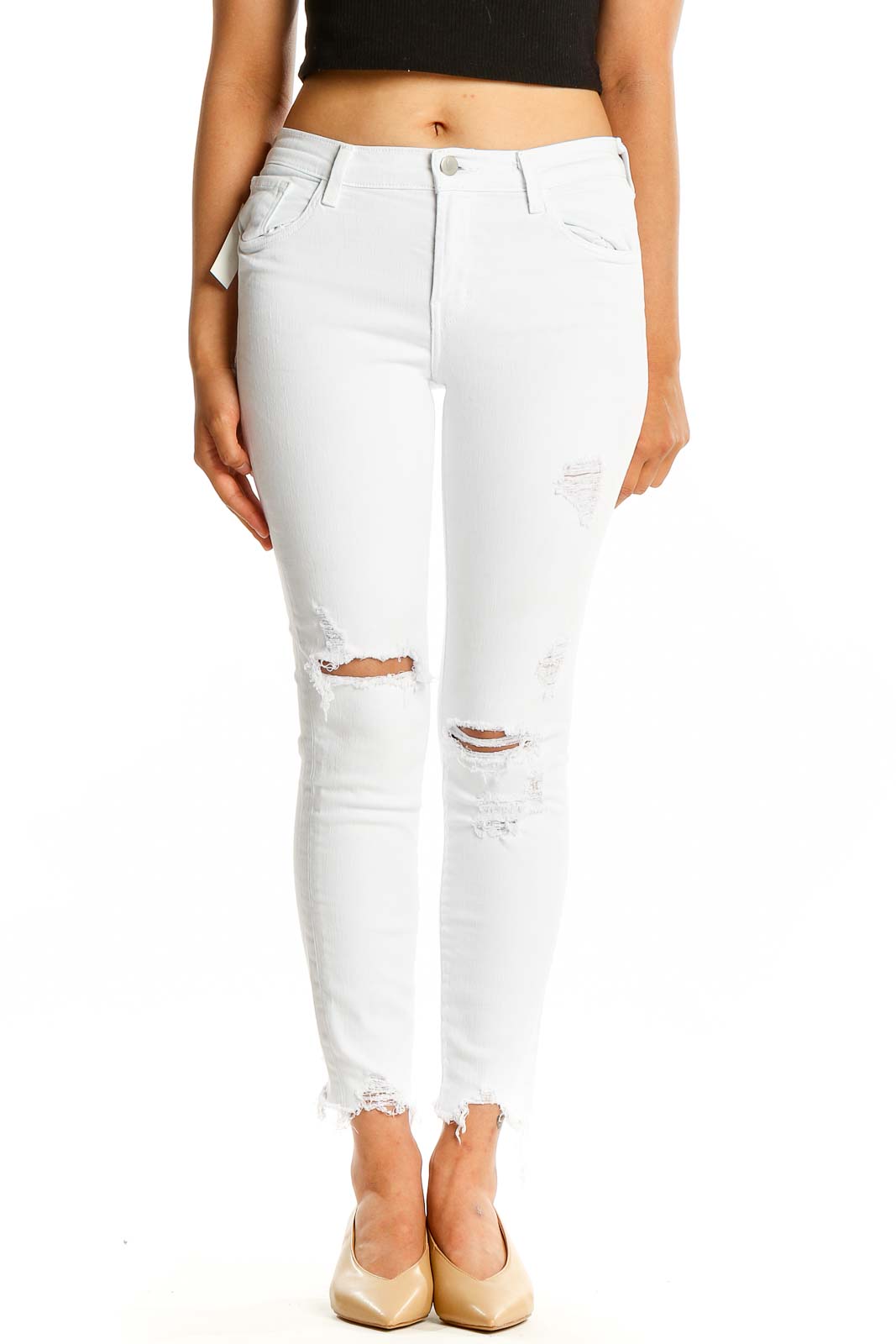 Front view of J Brand white distressed skinny jeans with ripped knees