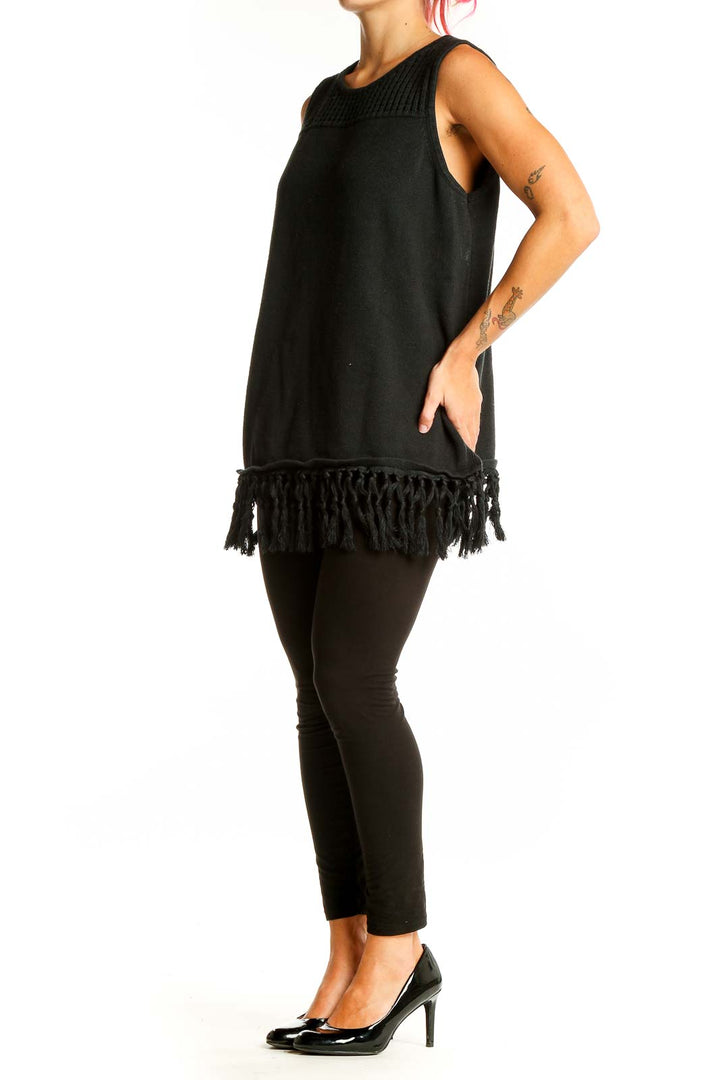 Front view of Jason Wu black sleeveless knit top with fringe hem and open-knit yoke