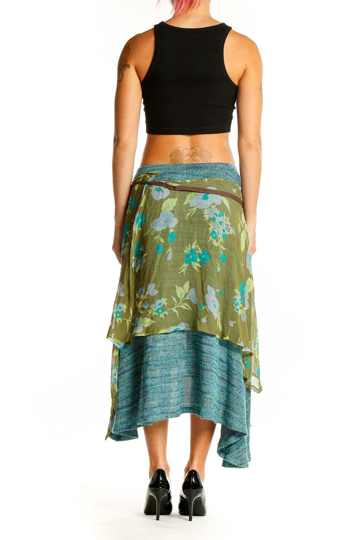 Back view of teal floral layered midi skirt showing high-low hemline