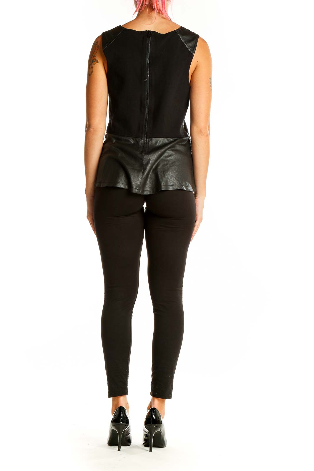 Back view of Sanctuary black leather peplum top showing sleeveless design