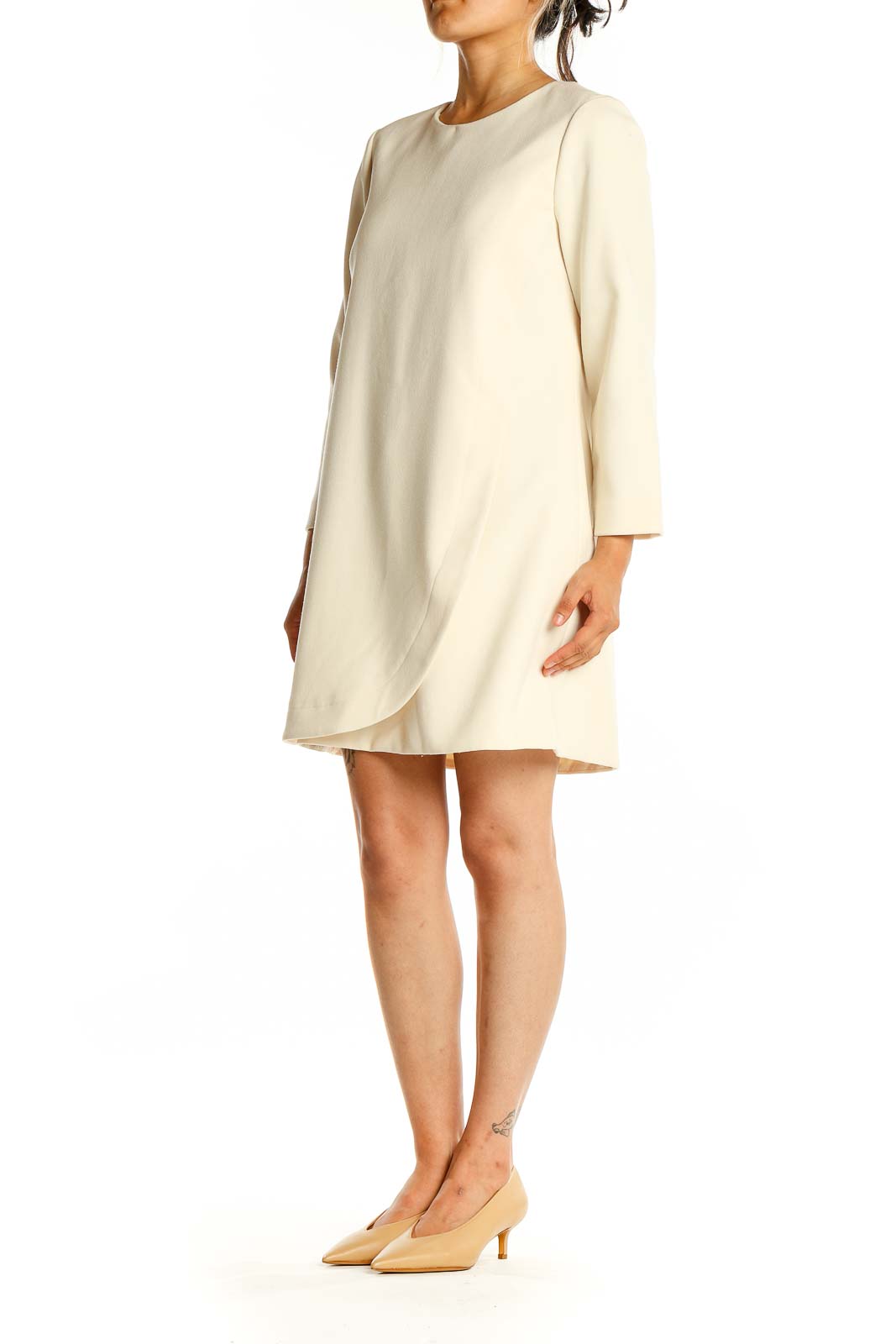 Front view of J.Crew cream shift dress with long sleeves