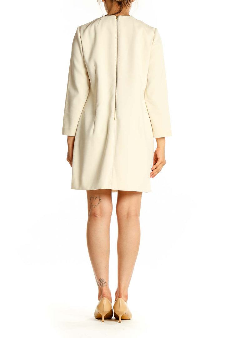 Back view of J.Crew cream shift dress showing zipper closure