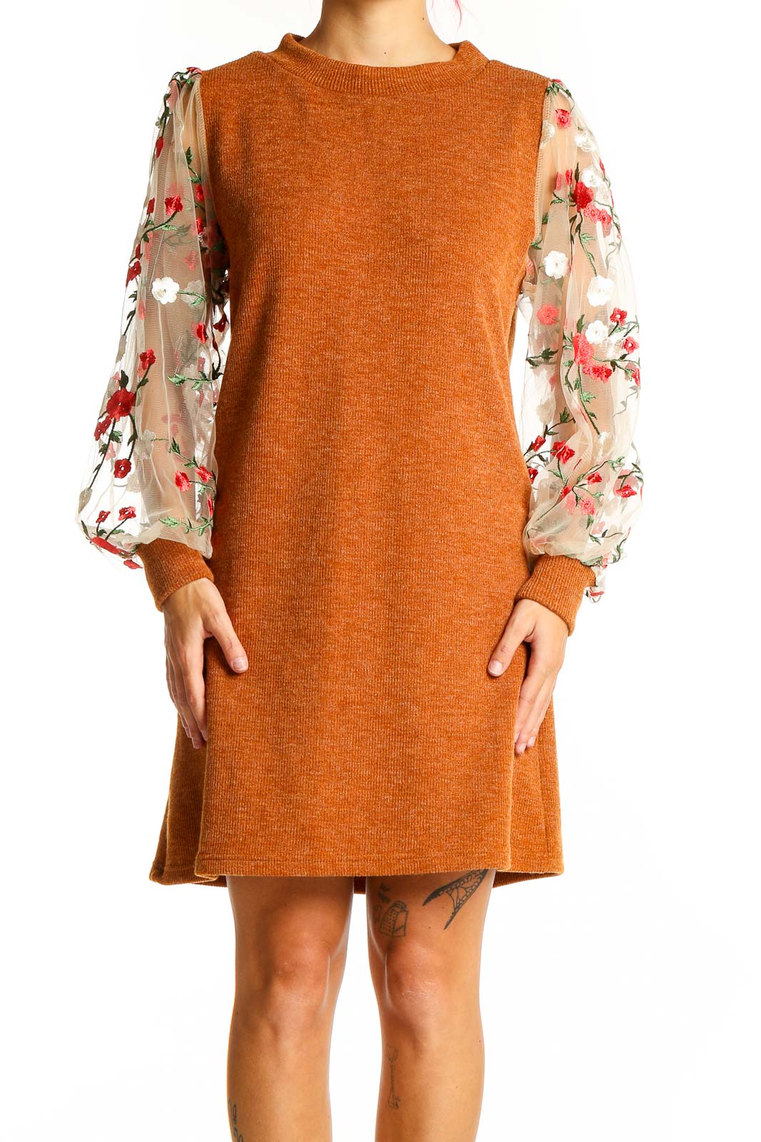 Front view of orange knit dress with floral mesh sleeves