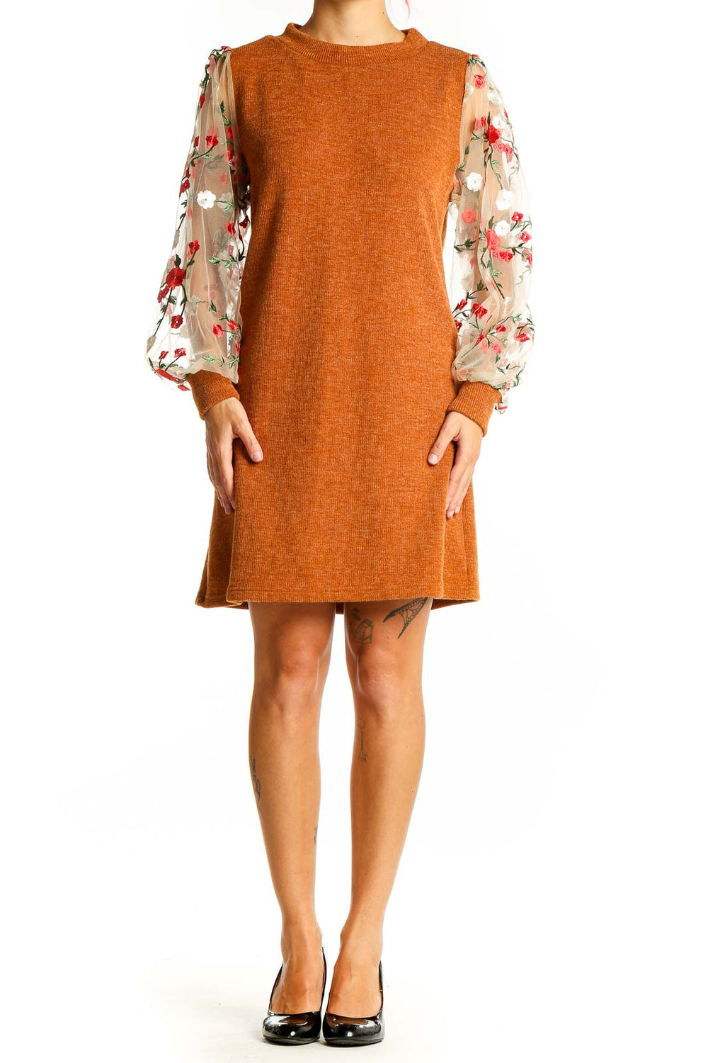 Front view of orange knit dress with floral mesh sleeves