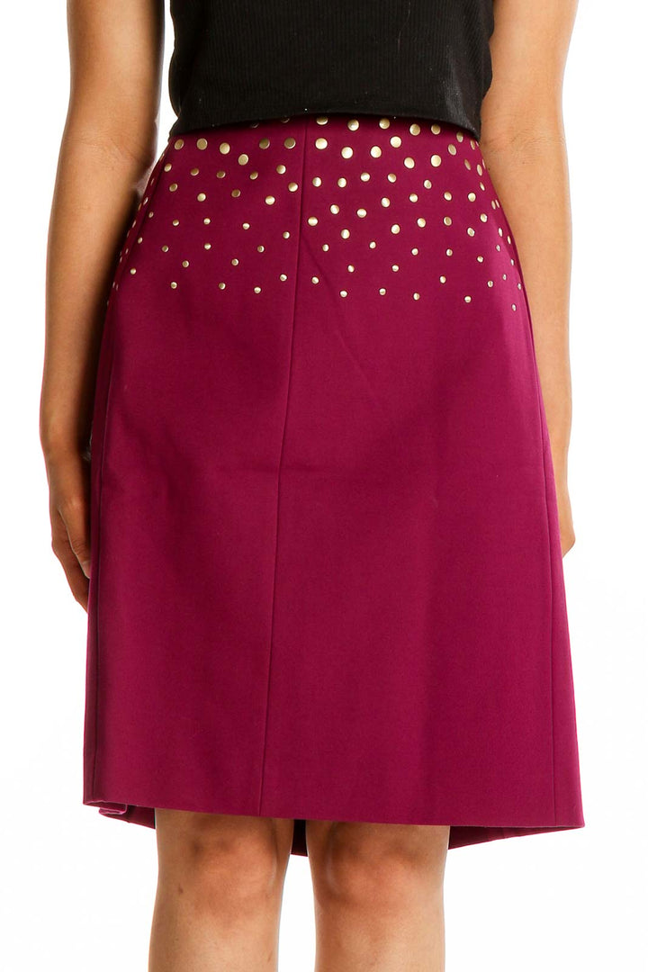 Front view of Antonio Melani burgundy A-line skirt with gold polka dots