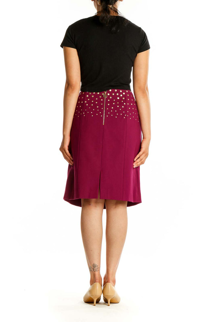 Back view of Antonio Melani burgundy A-line skirt with gold polka dots and zipper closure