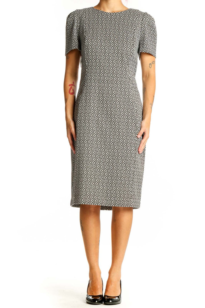 Front view of Calvin Klein black and white geometric sheath dress