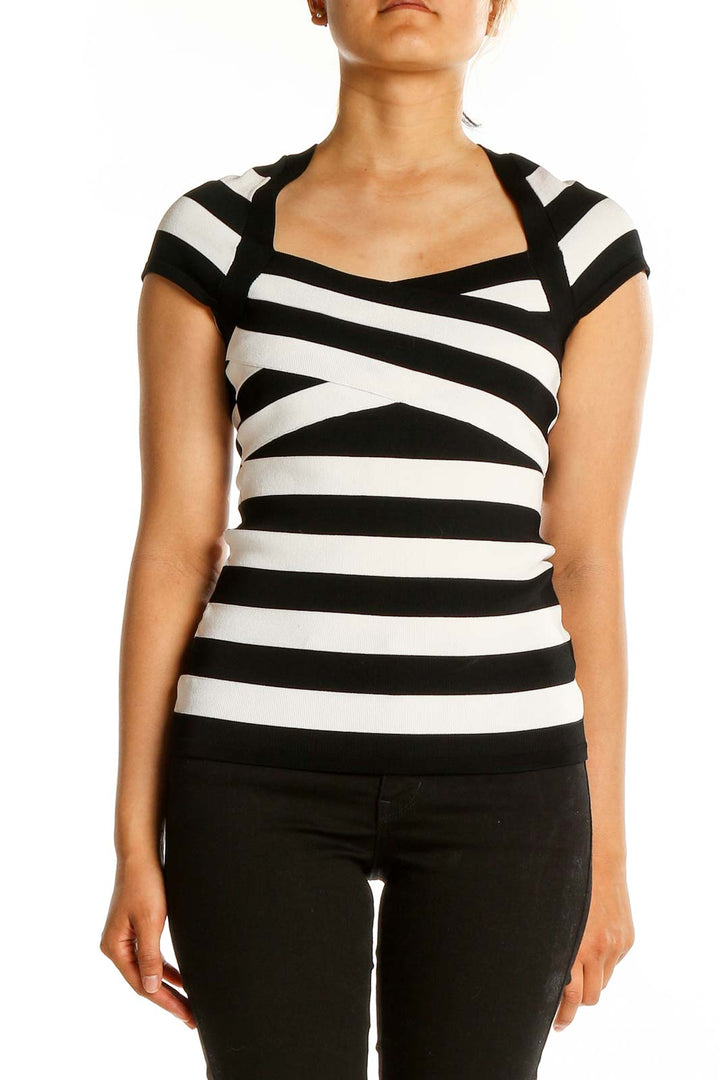 Front view of Black and White Striped Cap Sleeve Top with crisscross neckline