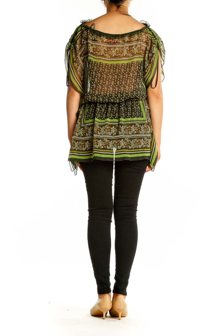 Back view of V Cristina green patterned sheer tunic top showing full length and pattern details