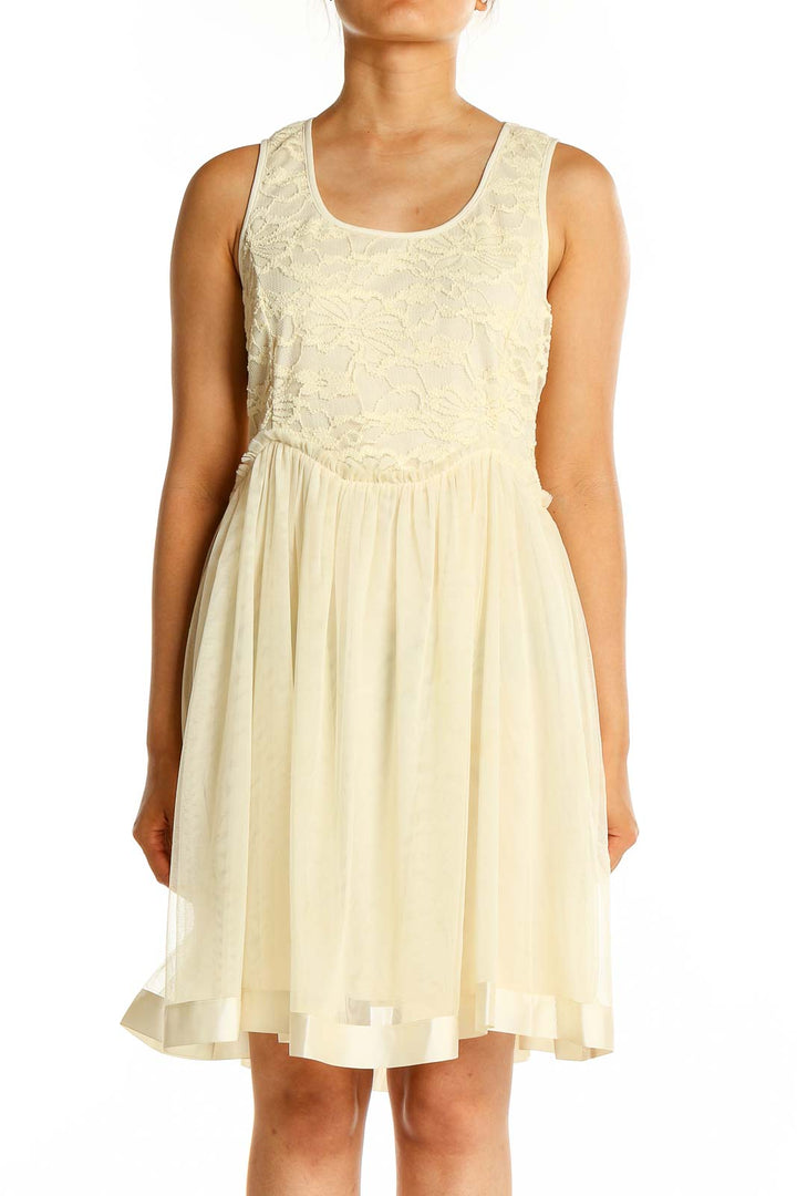 Front view of cream a'reve dress with lace bodice and flowy skirt