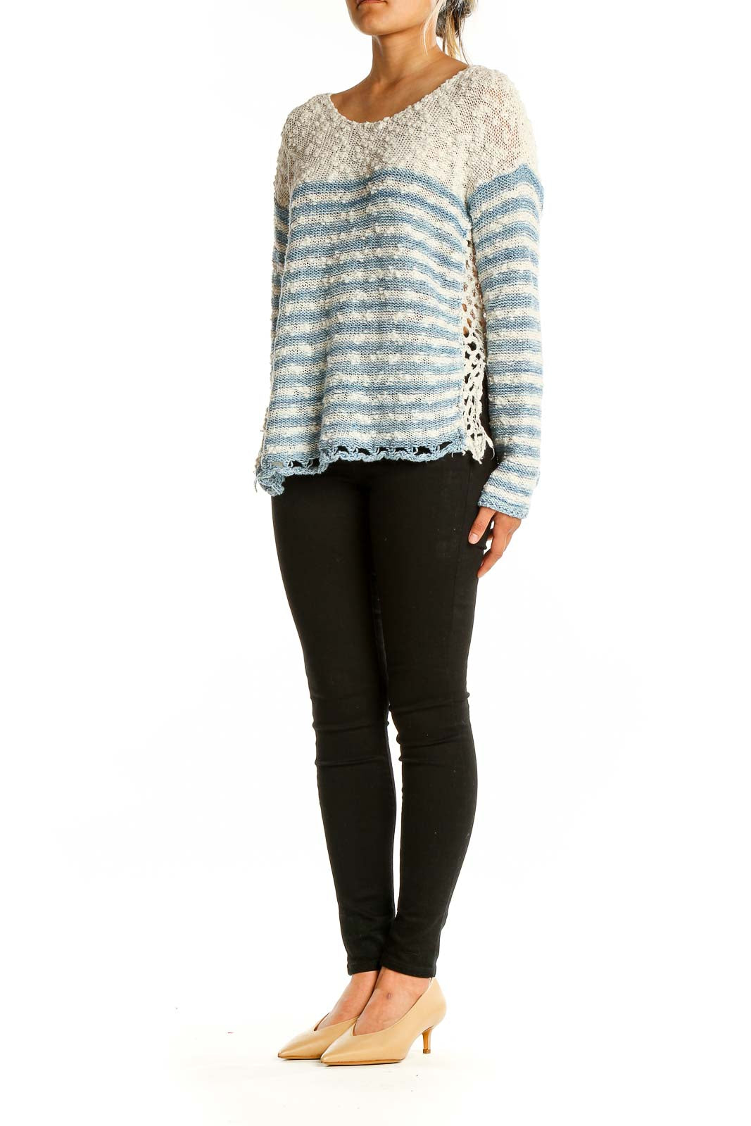 Front view of Free People blue and white striped knit sweater with scalloped hem