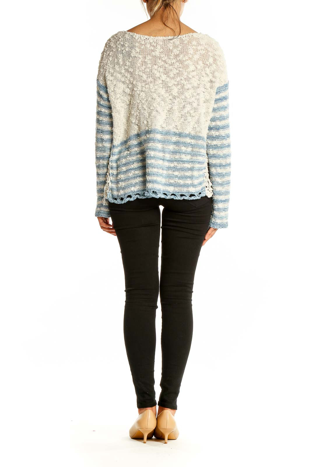 Back view of Free People blue and white striped knit sweater showing full pattern