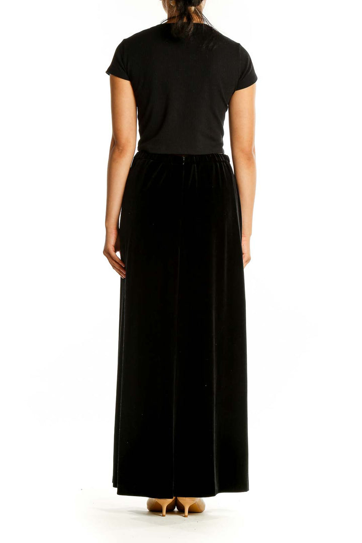 Back view of Alex Evenings black velvet maxi skirt