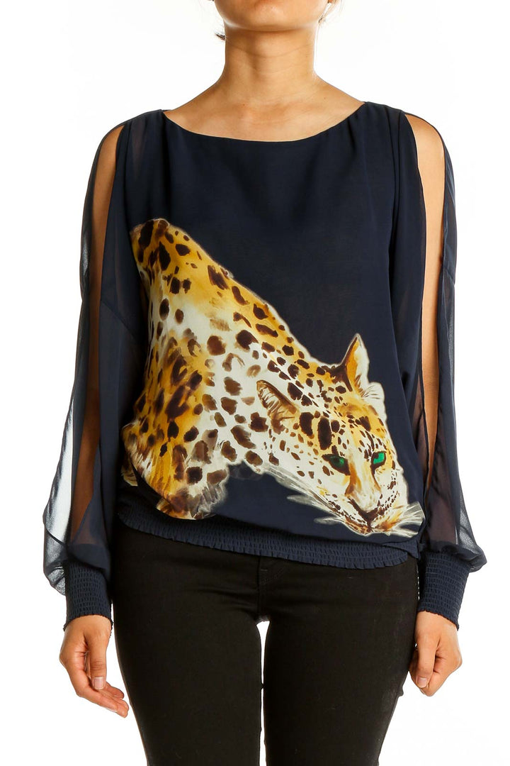 Front view of Trina Turk navy top with leopard print and sheer sleeves