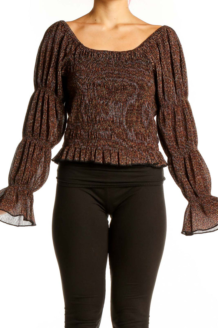 Front view of Anthropologie brown metallic smocked peasant top with off-shoulder design