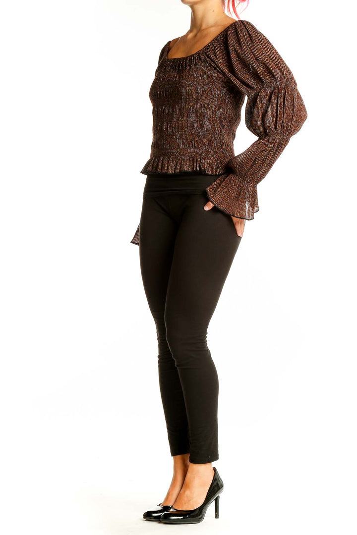 Front view of Anthropologie brown metallic smocked peasant top with off-shoulder design